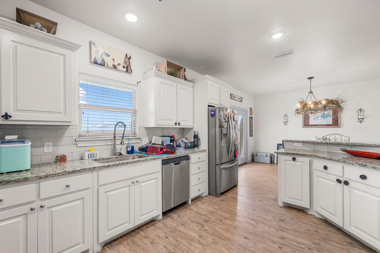 542 Nora Road Wilson, TX 79381 - Photo 24 of 42 a kitchen with refrigerator and cabinets