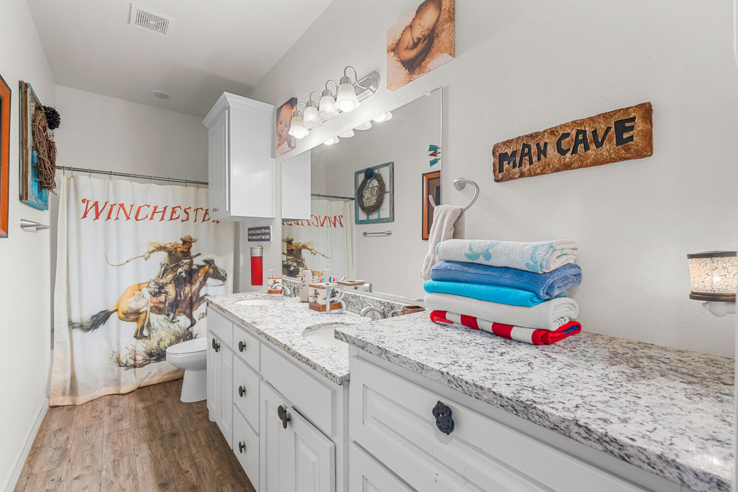 542 Nora Road Wilson, TX 79381 - Photo 26 of 42 a bathroom with a sink a vanity and a mirror