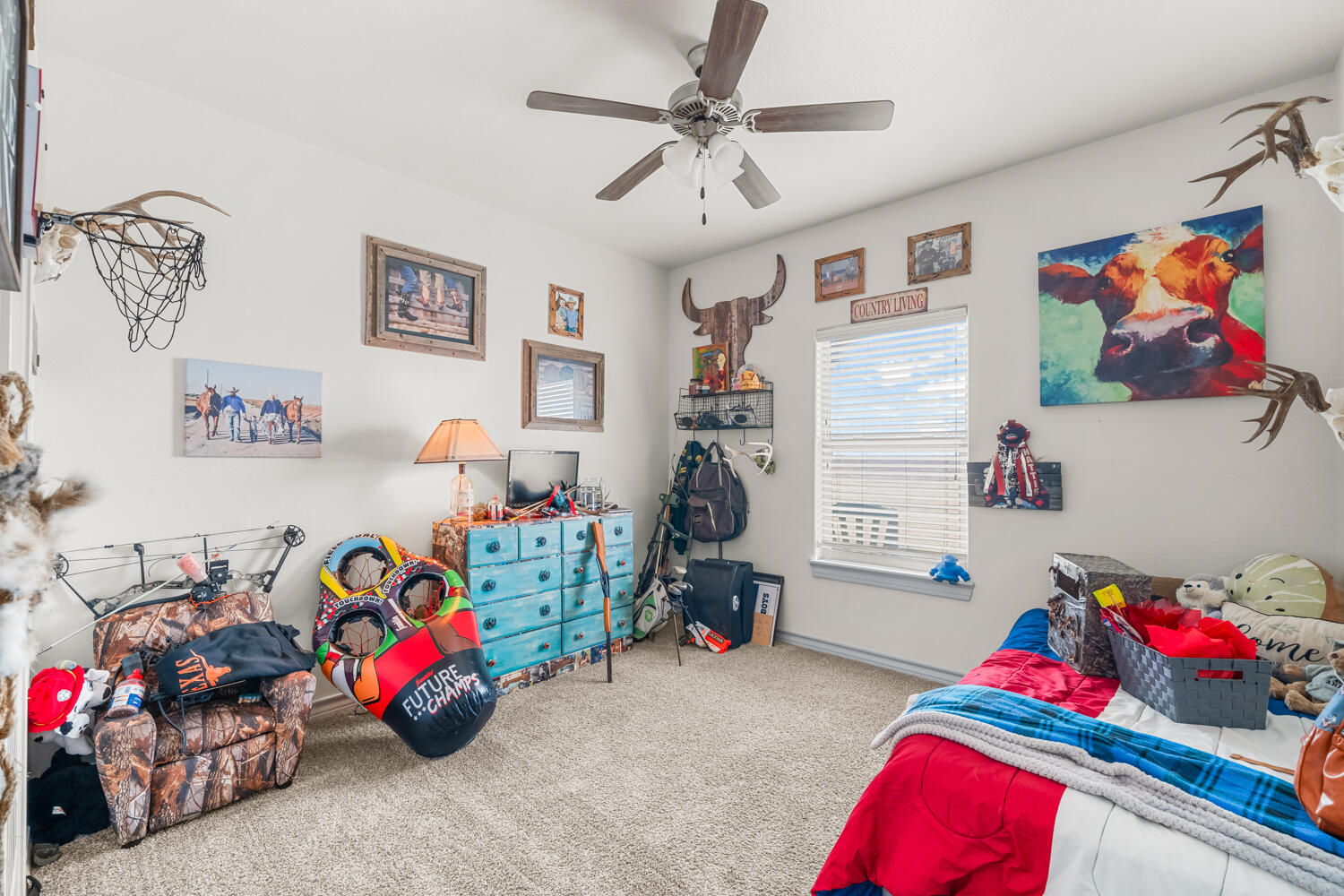542 Nora Road Wilson, TX 79381 - Photo 27 of 42 a bedroom with toys and a couch