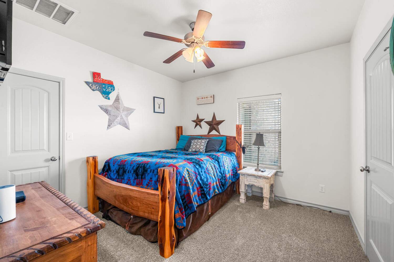 542 Nora Road Wilson, TX 79381 - Photo 29 of 42 a bedroom with a bed and a table in it