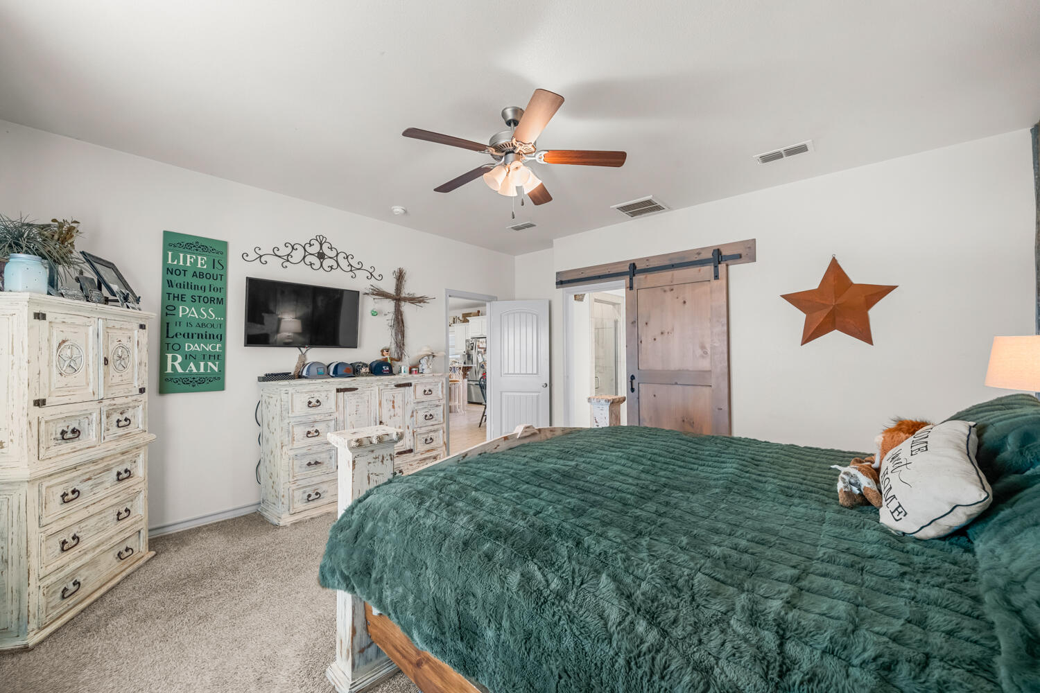 542 Nora Road Wilson, TX 79381 - Photo 7 of 42 a living room with flat screen tv and a dresser