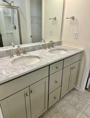 a bathroom with a glass shower door