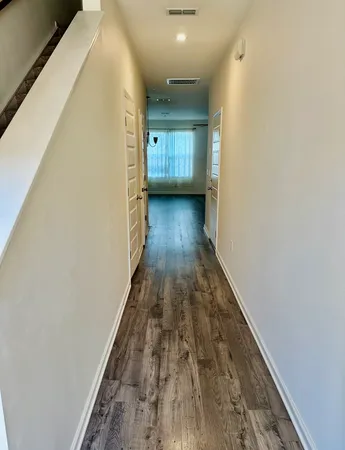 a view of gallery with wooden floor