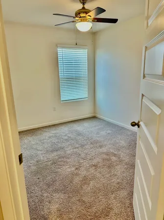 a white toilet sitting next to a sink