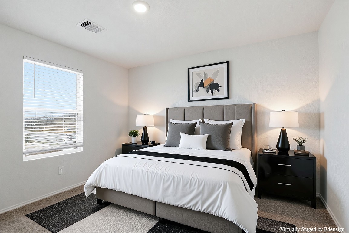 427 Sickle Loop Kyle, TX 78640 - Photo 12 of 39 Bedroom with carpet flooring and baseboards