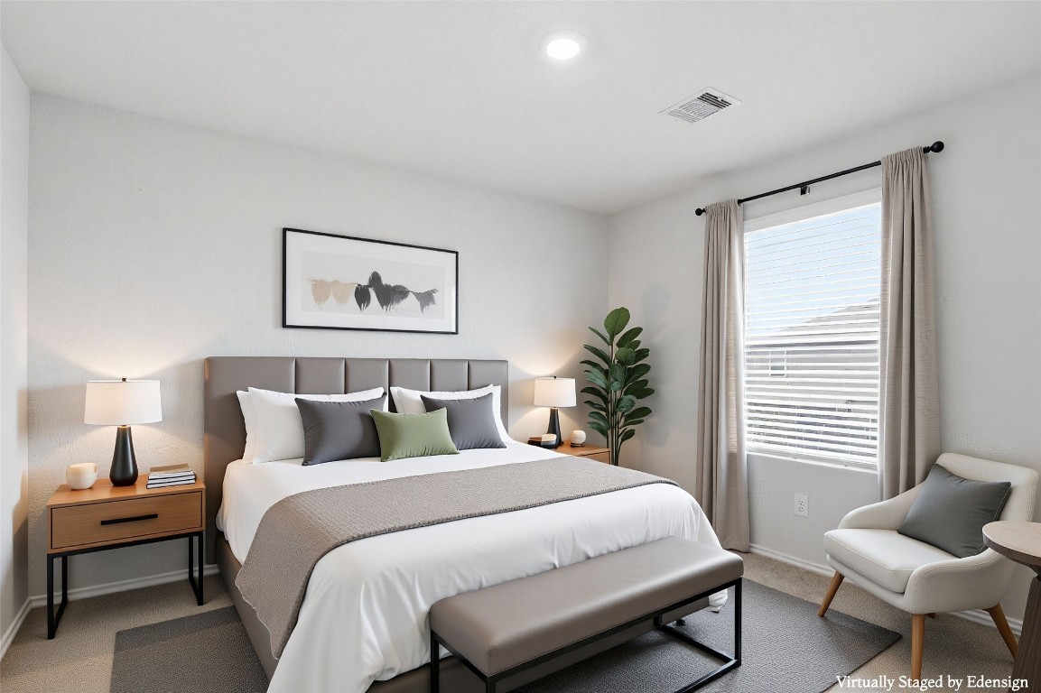 427 Sickle Loop Kyle, TX 78640 - Photo 14 of 39 Carpeted bedroom featuring baseboards