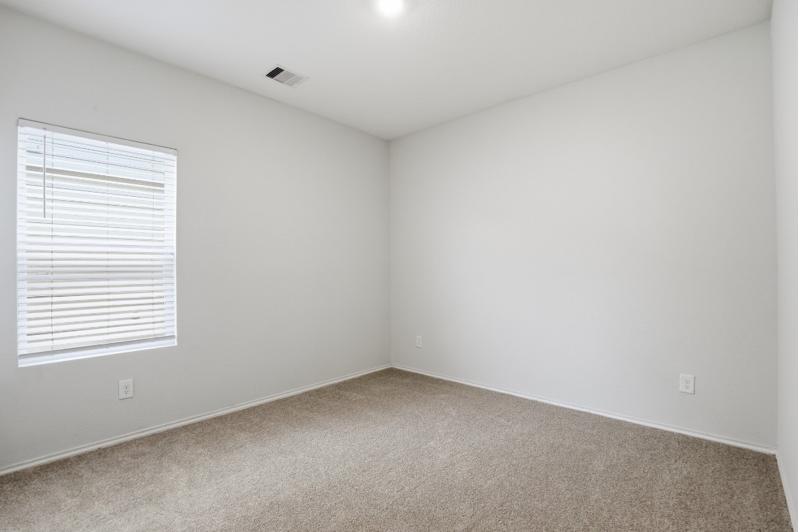 427 Sickle Loop Kyle, TX 78640 - Photo 20 of 39 Carpeted empty room featuring baseboards