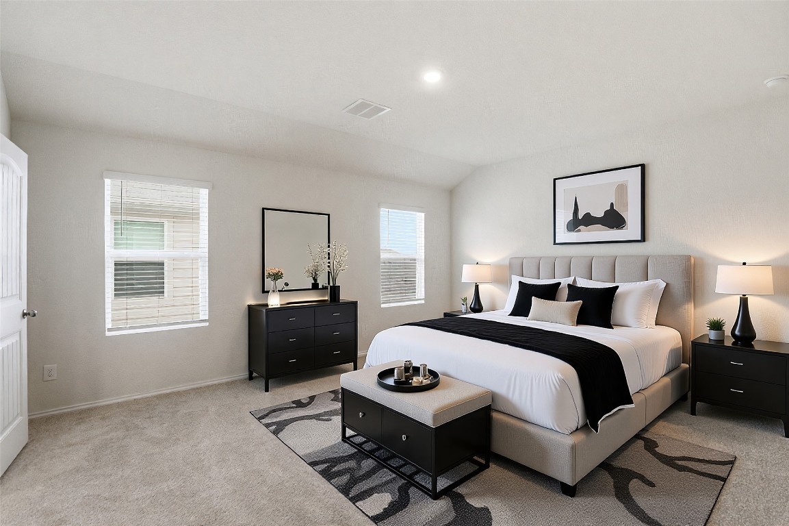 427 Sickle Loop Kyle, TX 78640 - Photo 2 of 39 Bedroom with light colored carpet, vaulted ceiling, and recessed lighting
