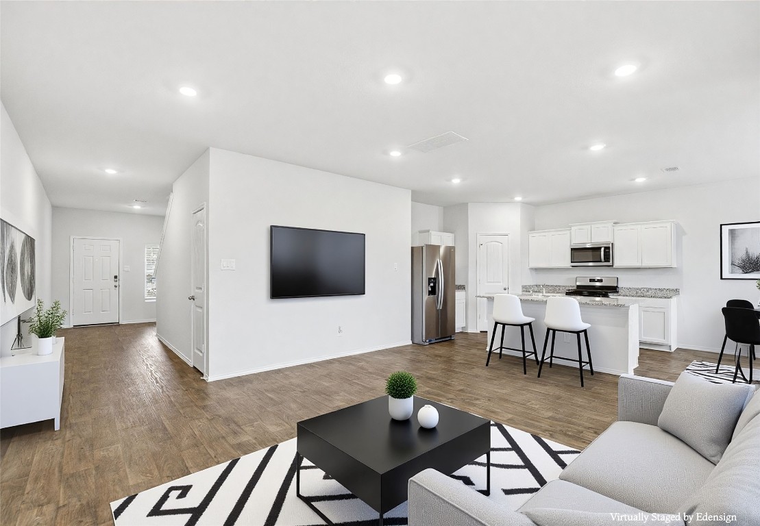 427 Sickle Loop Kyle, TX 78640 - Photo 24 of 39 Living room featuring dark wood-style flooring and recessed lighting