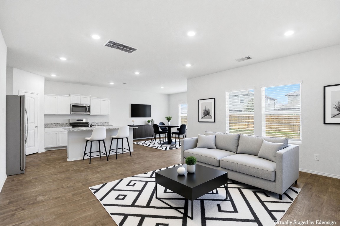 427 Sickle Loop Kyle, TX 78640 - Photo 30 of 39 Living room with dark wood finished floors and recessed lighting