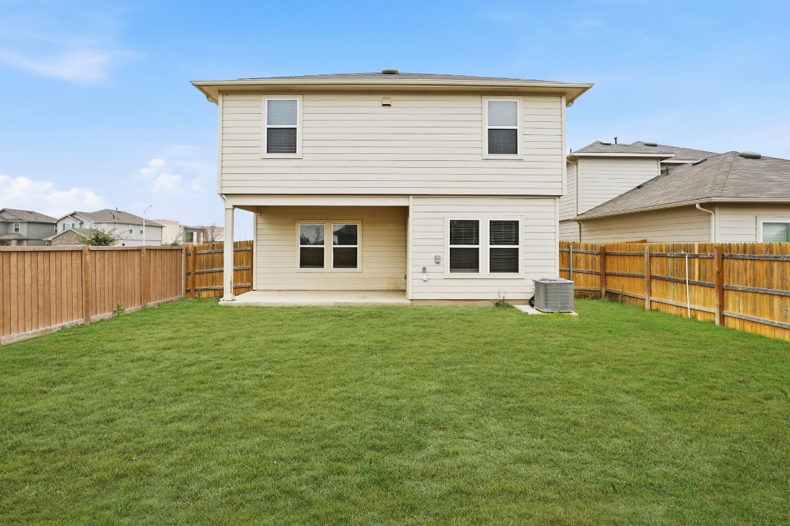 427 Sickle Loop Kyle, TX 78640 - Photo 35 of 39 Back of property with a patio area and a fenced backyard