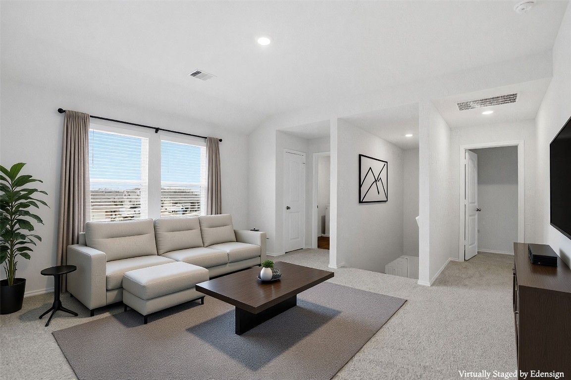 427 Sickle Loop Kyle, TX 78640 - Photo 7 of 39 Living room featuring light carpet and recessed lighting