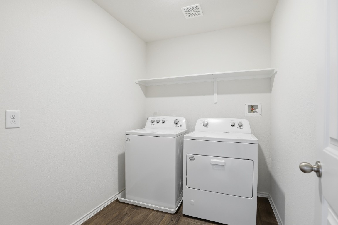 427 Sickle Loop Kyle, TX 78640 - Photo 9 of 39 Washroom featuring hookup for a washing machine and dark wood-type flooring