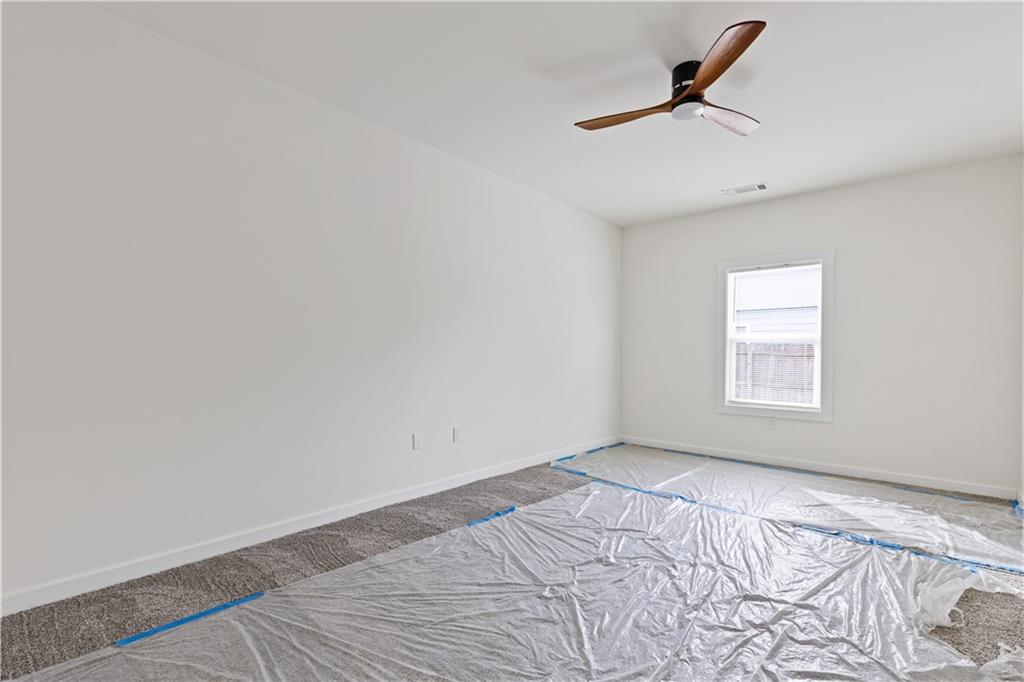 3272 Corktree Trail Lithonia, GA 30038 - Photo 12 of 22 a view of a room with a window and a ceiling fan