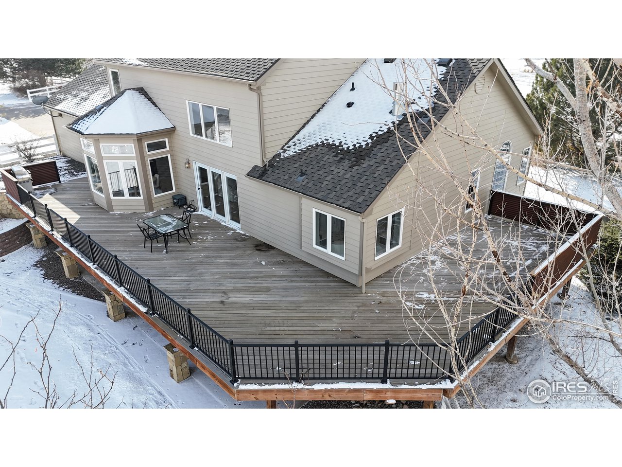 7904 Windsong Road Windsor, CO 80550 - Photo 11 of 40 Wrap Around Back Porch
