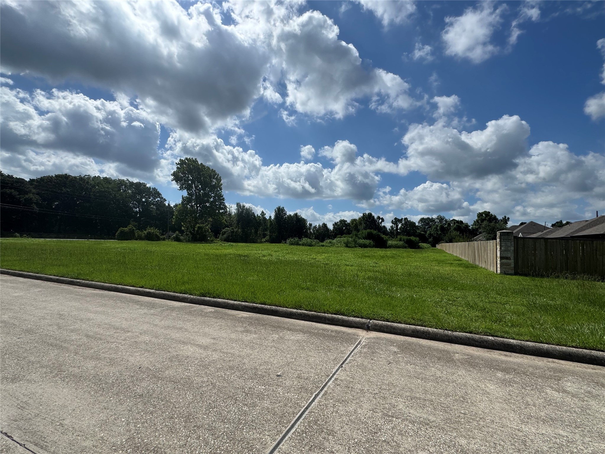 0 South Winfree Street Dayton, TX 77535 - Photo 12 of 14 a view of a bench in a yard with potted plants