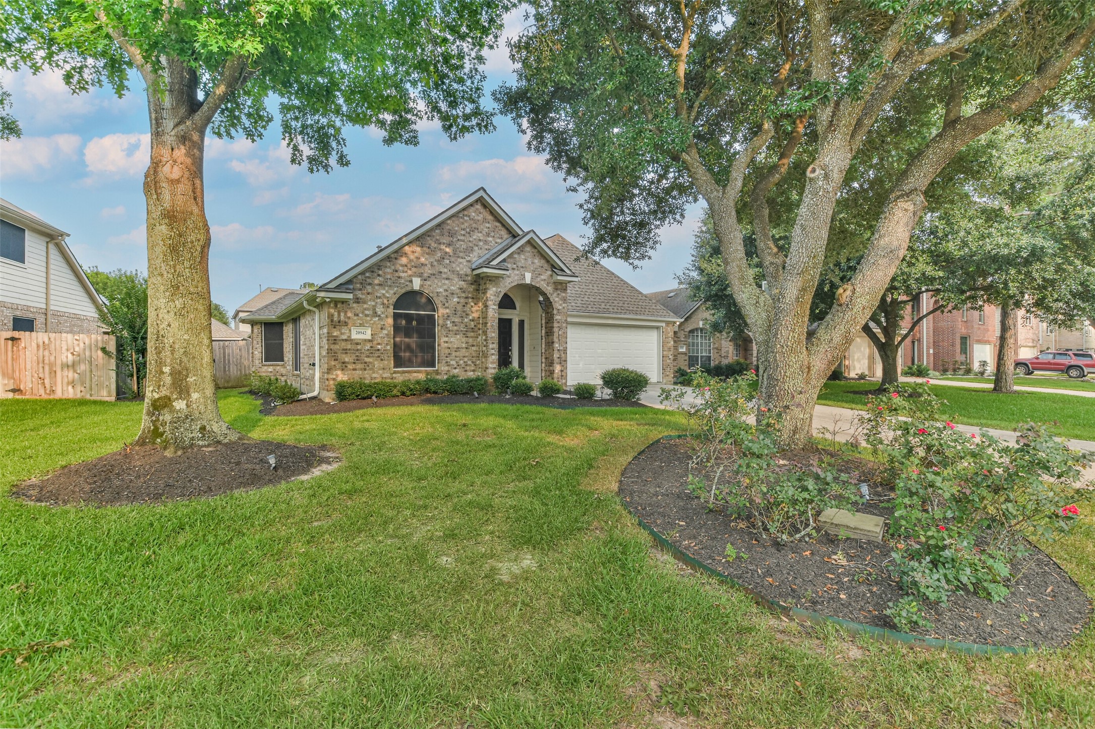 20942 Wind Field Lane Spring, TX 77379 - Photo 45 of 46 a view of a house with a big yard plants and large trees