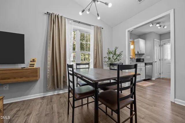 a kitchen with a sink cabinets and window