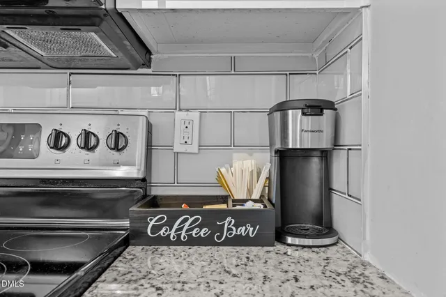 a kitchen with granite countertop a sink and a window