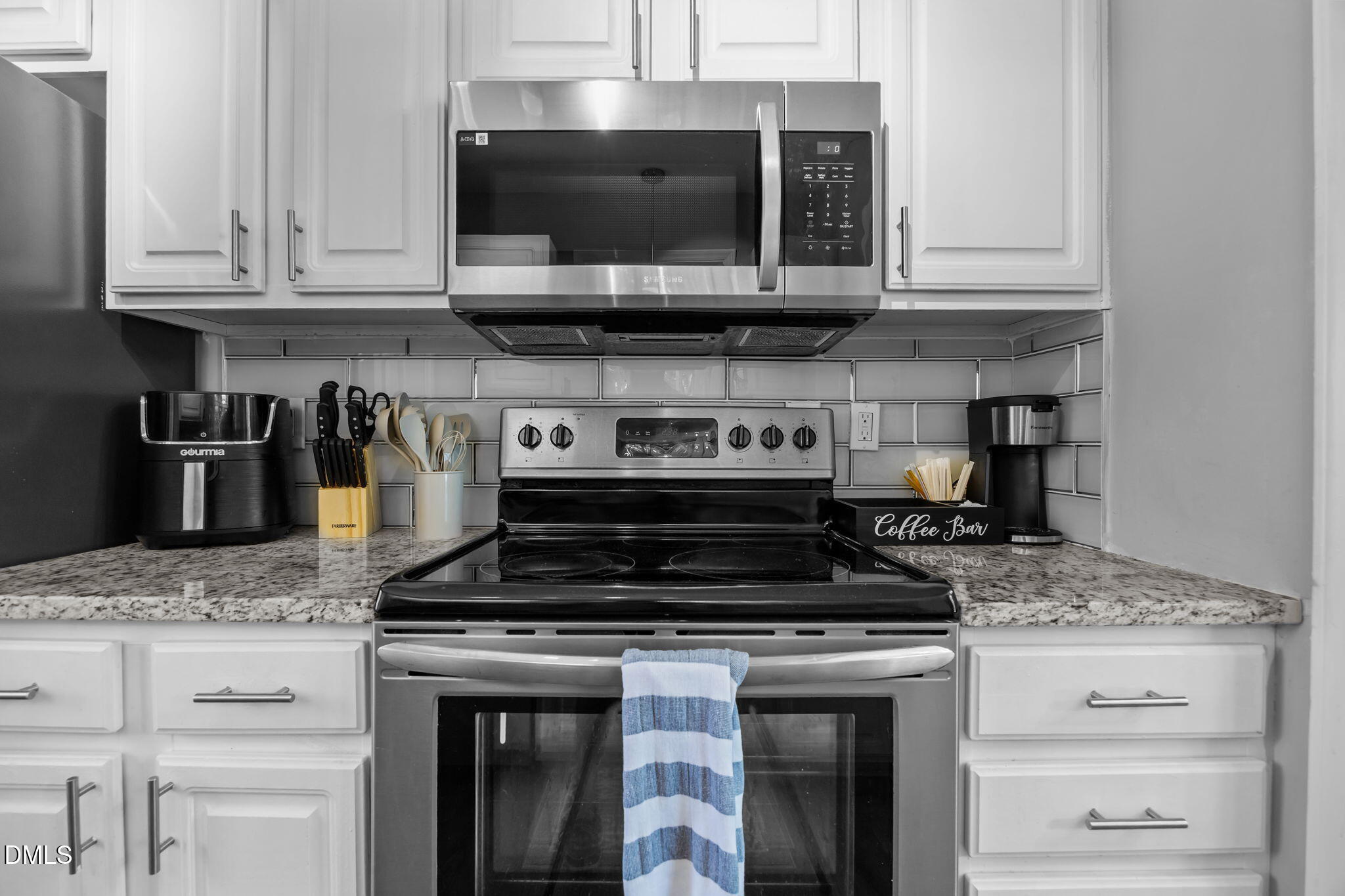 231 Highgate Circle Wake Forest, NC 27587 - Photo 25 of 61 a kitchen with stainless steel appliances granite countertop a stove and a microwave