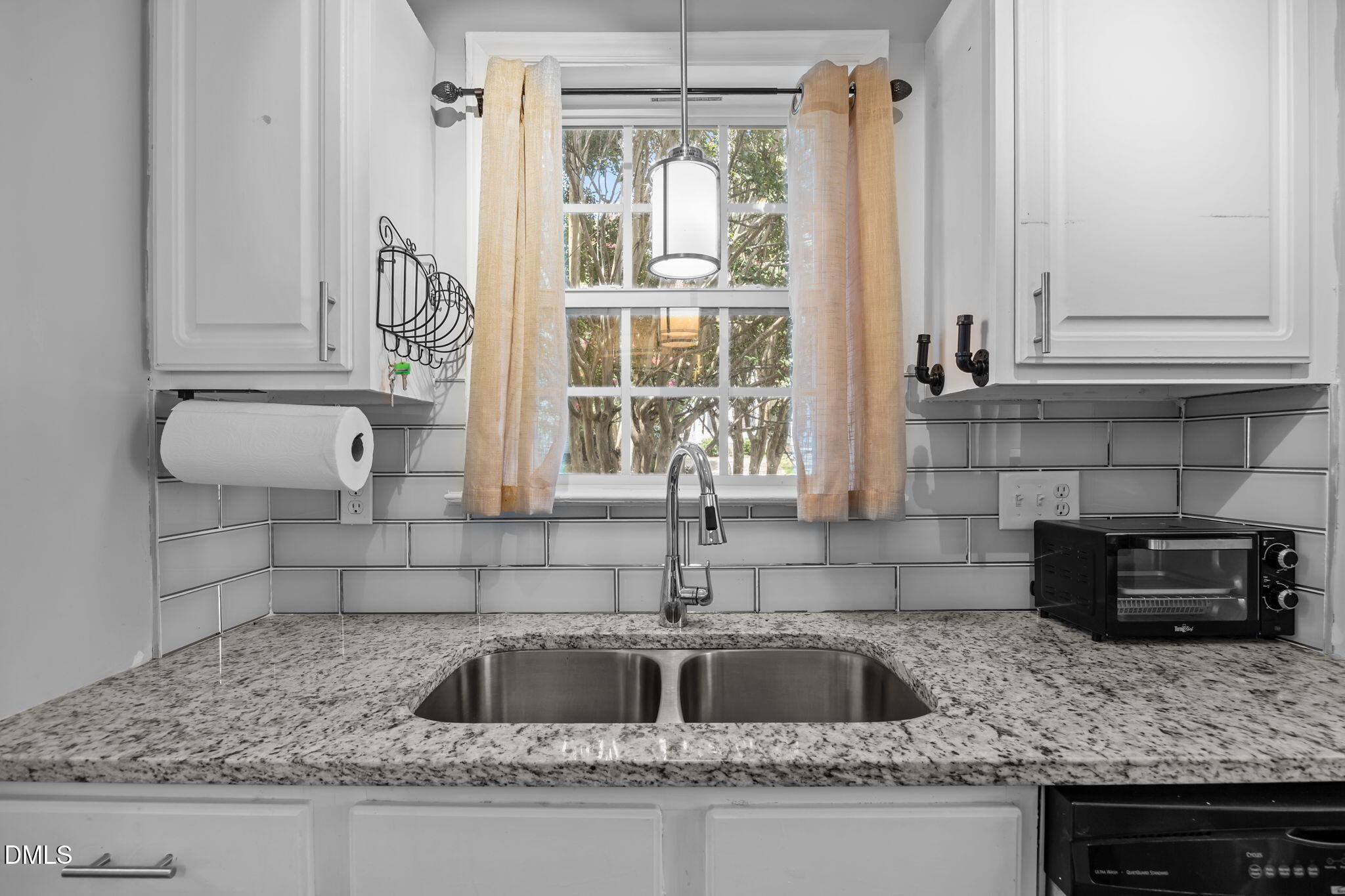 231 Highgate Circle Wake Forest, NC 27587 - Photo 26 of 61 a kitchen with granite countertop a sink and a window