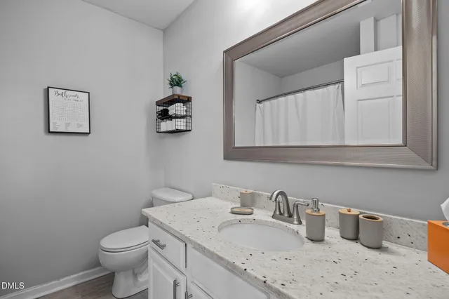 a bedroom with a bed and a lamp