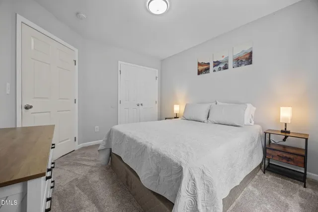 a room with a bed and a view of bedroom