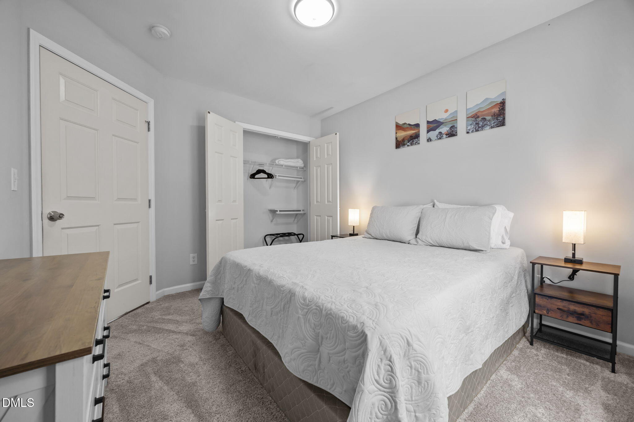 231 Highgate Circle Wake Forest, NC 27587 - Photo 37 of 61 a bedroom with a bed and a lamp