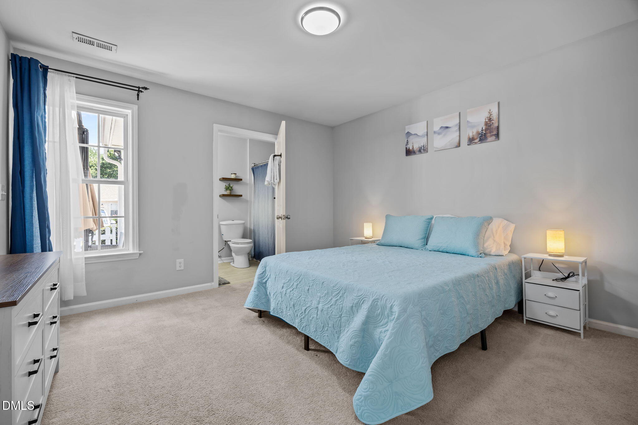 231 Highgate Circle Wake Forest, NC 27587 - Photo 40 of 61 a spacious bedroom with a bed and a window