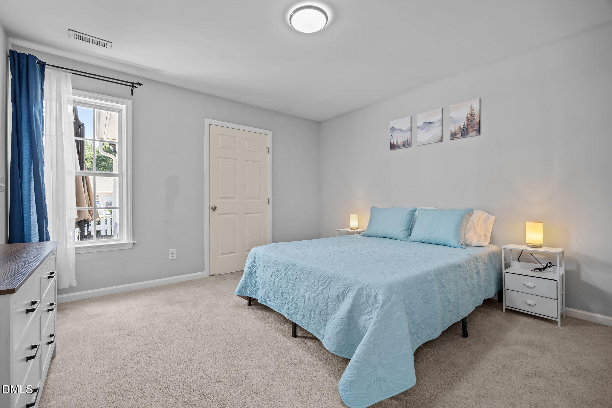 231 Highgate Circle Wake Forest, NC 27587 - Photo 41 of 61 a spacious bedroom with a bed and a window