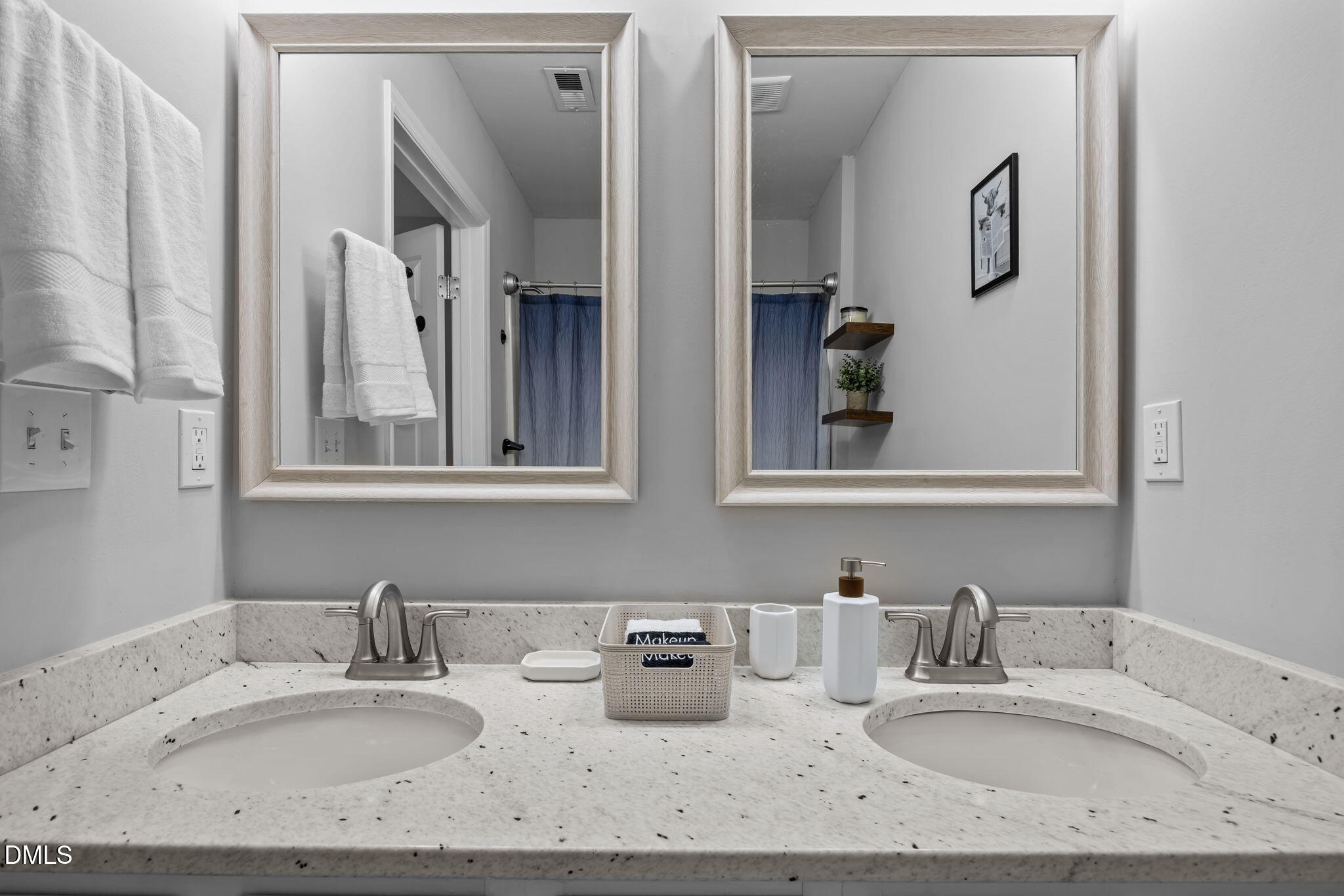 231 Highgate Circle Wake Forest, NC 27587 - Photo 45 of 61 a bathroom with double vanity sinks and a mirror