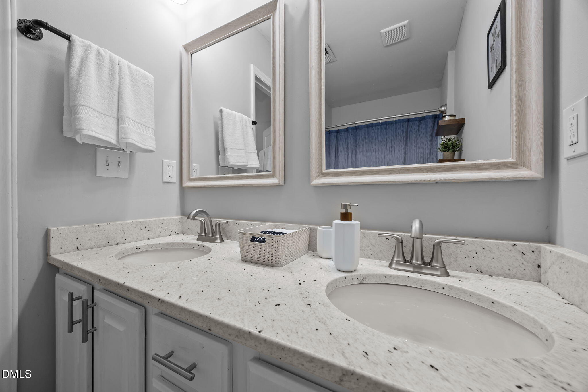 231 Highgate Circle Wake Forest, NC 27587 - Photo 46 of 61 a bathroom with a sink and a mirror