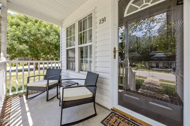 a view of a chair and table in the balcony