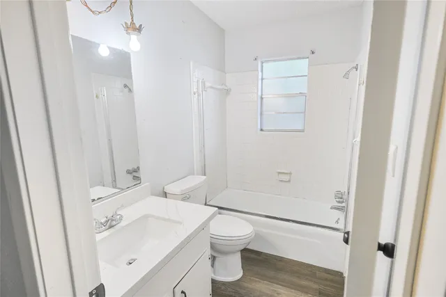 a bathroom with a toilet a sink and a bathtub