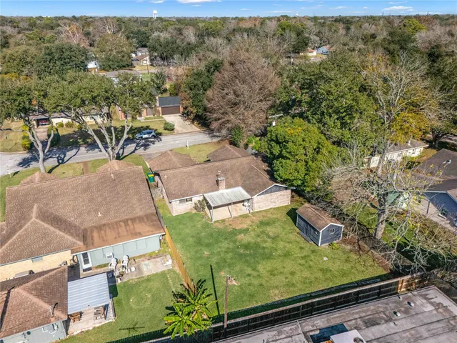 an aerial view of residential houses with outdoor space