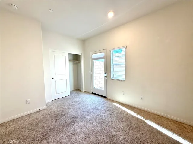 a bathroom with a shower a sink a toilet and a mirror