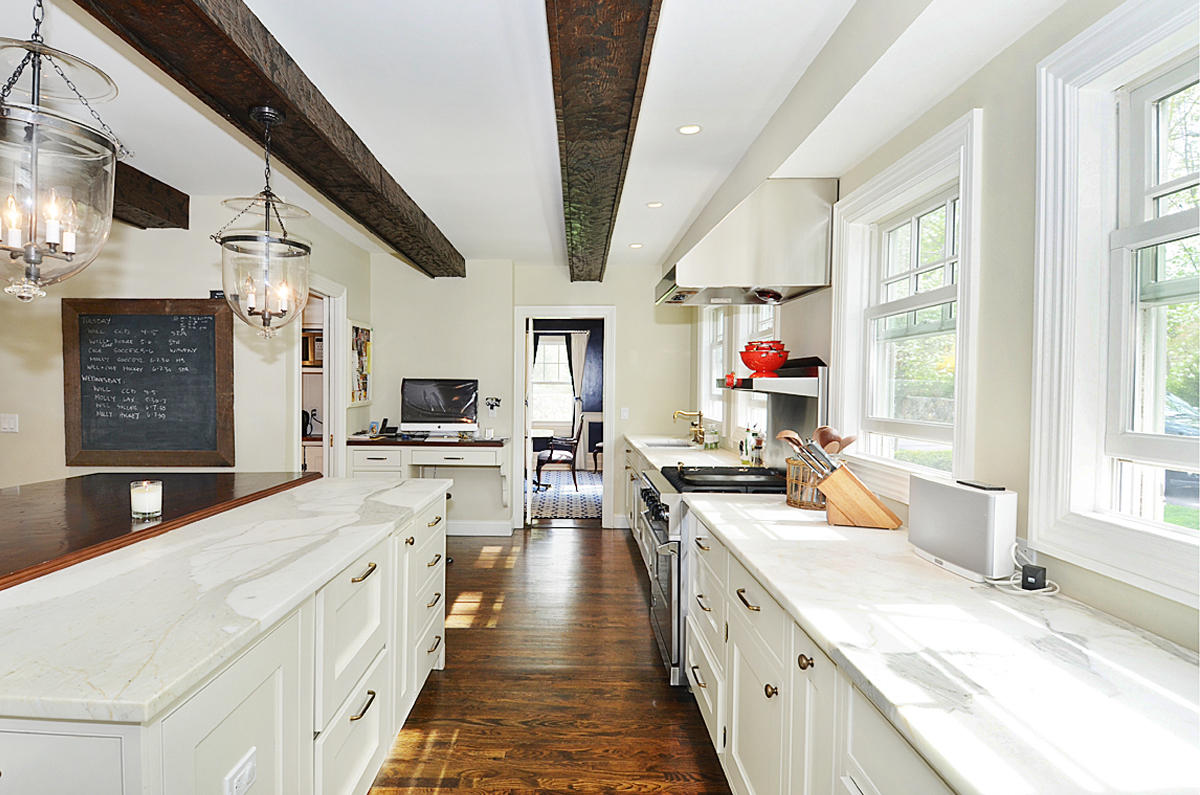 277 Country Club Road New Canaan, CT 06840 - Photo 11 of 29 a large kitchen with stainless steel appliances granite countertop a lot of counter space and wooden floors