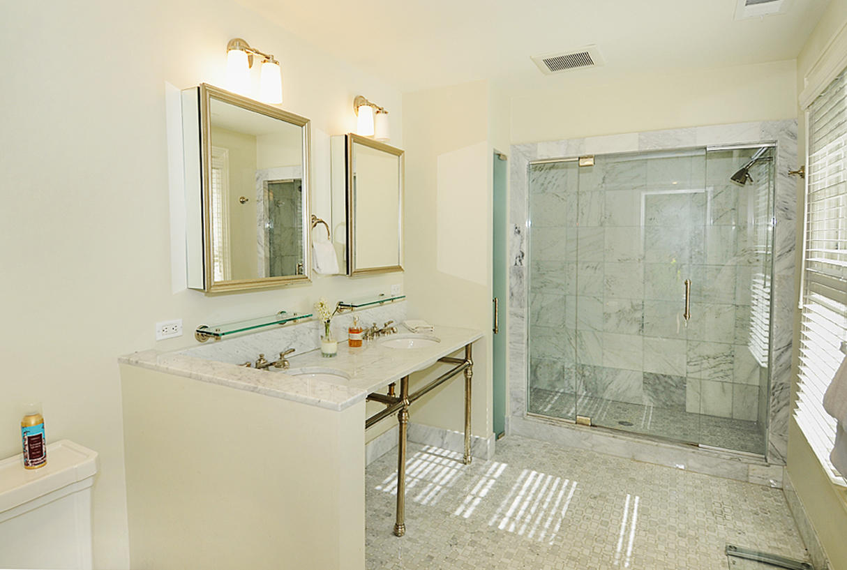 277 Country Club Road New Canaan, CT 06840 - Photo 17 of 29 a bathroom with a sink mirror and shower