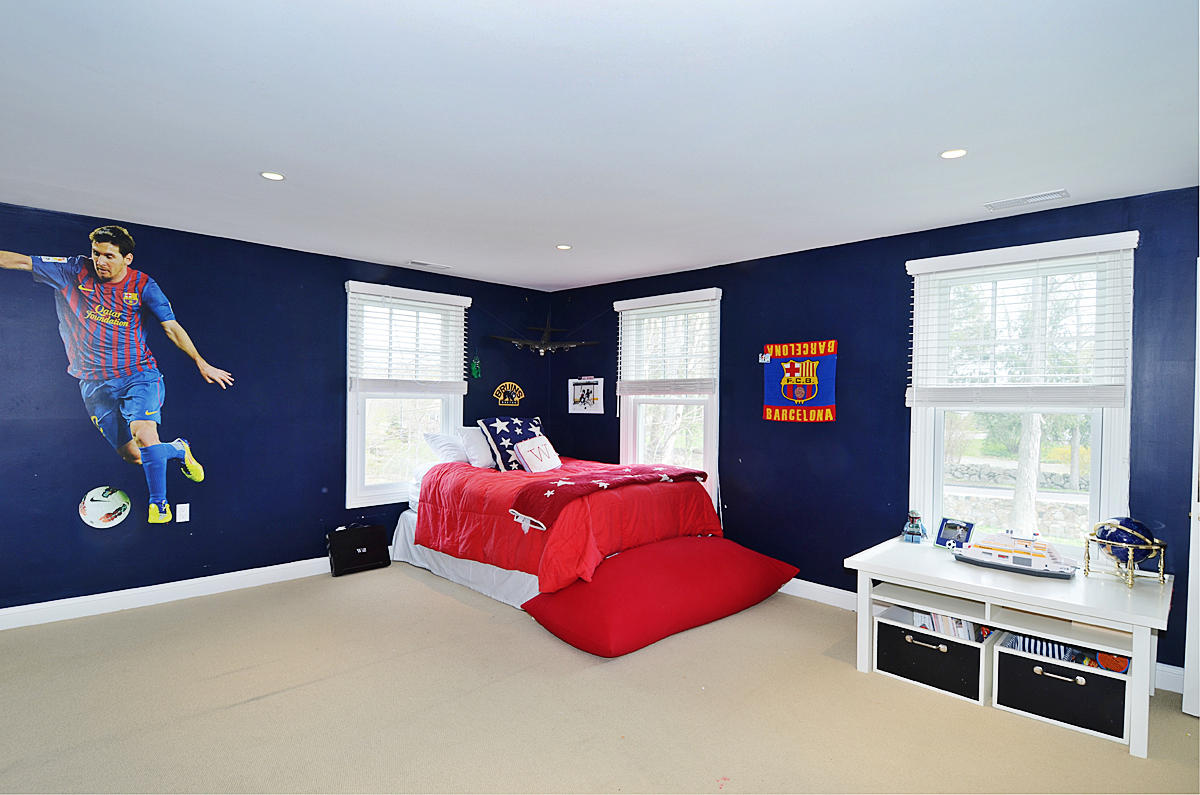 277 Country Club Road New Canaan, CT 06840 - Photo 19 of 29 a bedroom with a bed and a window