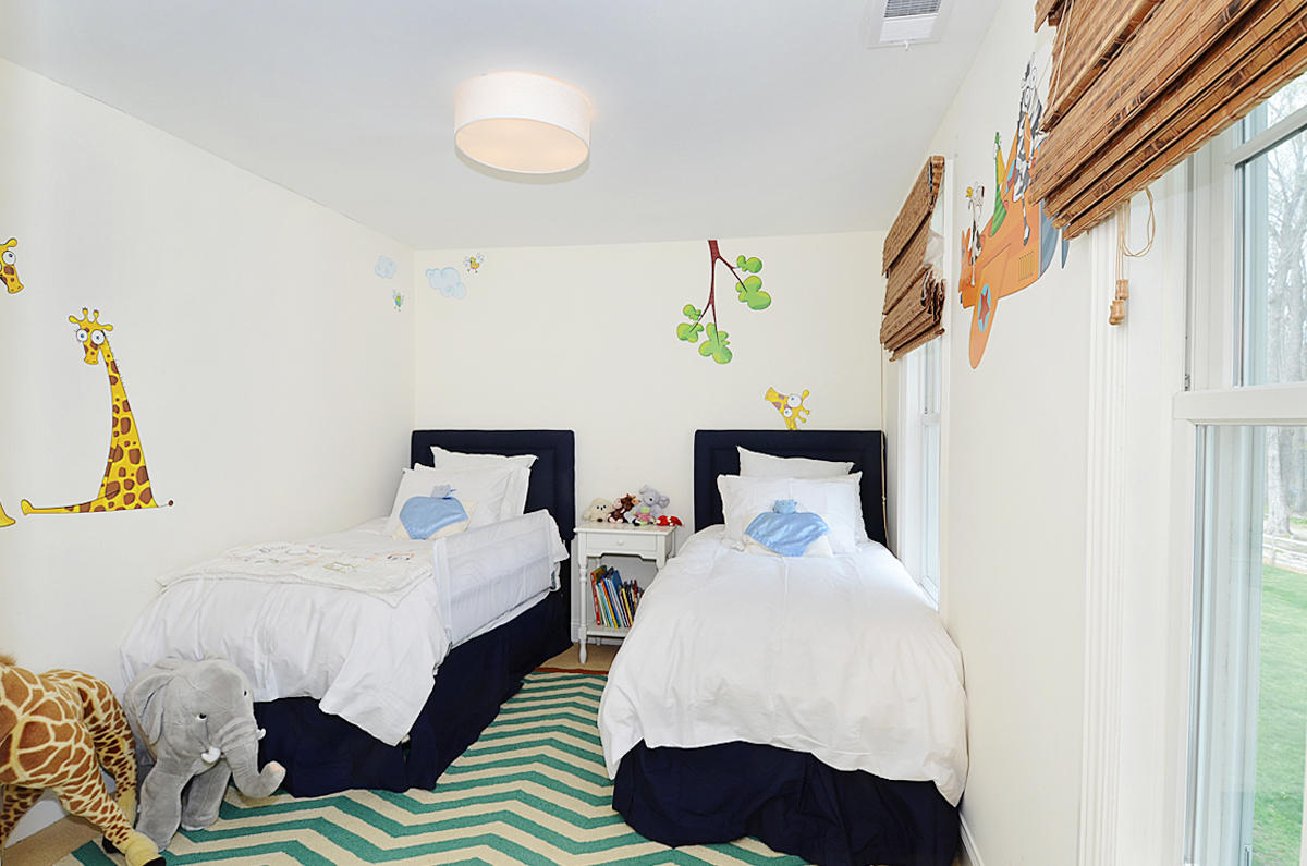 277 Country Club Road New Canaan, CT 06840 - Photo 20 of 29 a bedroom with two beds and painting on the wall