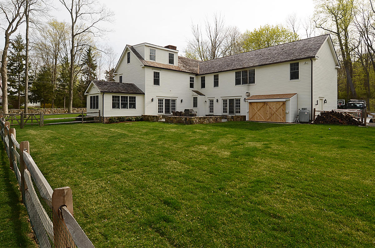 277 Country Club Road New Canaan, CT 06840 - Photo 26 of 29 a view of a house with a yard