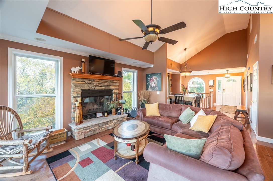 309 Pinnacle Ridge Road Beech Mountain, NC 28604 - Photo 16 of 45 a living room with furniture and a fireplace