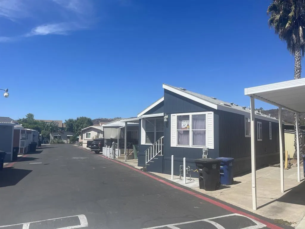 255 East Bradley Avenue, Unit SPC 79 El Cajon, CA 92020 - Photo 16 of 22 a view of a house with a patio