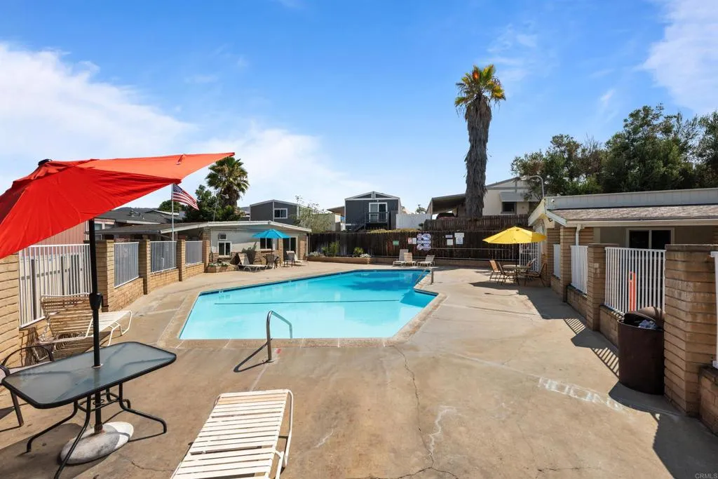 255 East Bradley Avenue, Unit SPC 79 El Cajon, CA 92020 - Photo 22 of 22 a view of a house with swimming pool