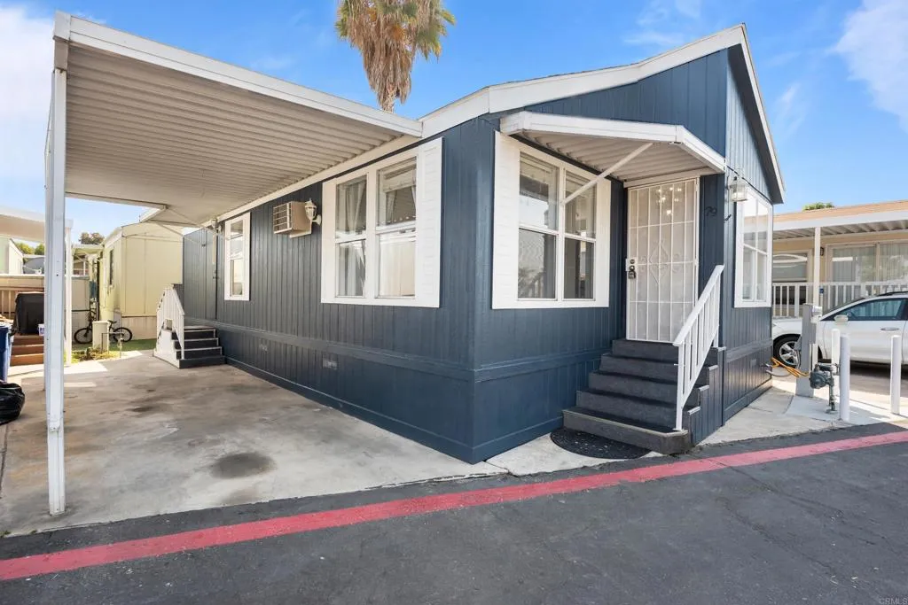 255 East Bradley Avenue, Unit SPC 79 El Cajon, CA 92020 - Photo 3 of 22 a view of house with a yard