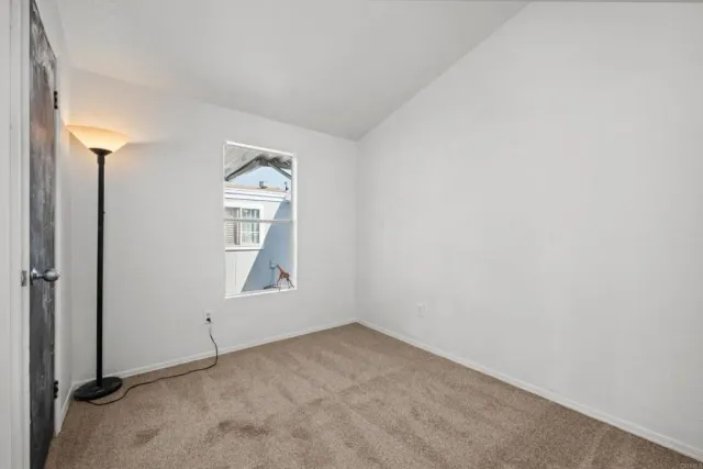 a bathroom with a granite countertop sink a toilet and a bathtub