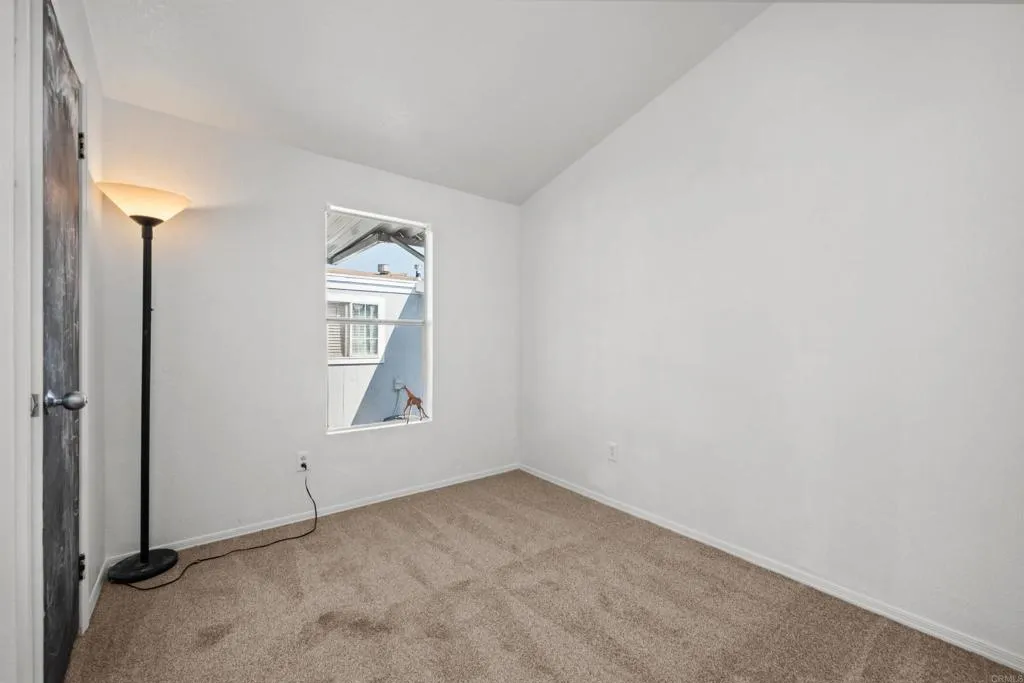 255 East Bradley Avenue, Unit SPC 79 El Cajon, CA 92020 - Photo 10 of 22 an empty room with windows