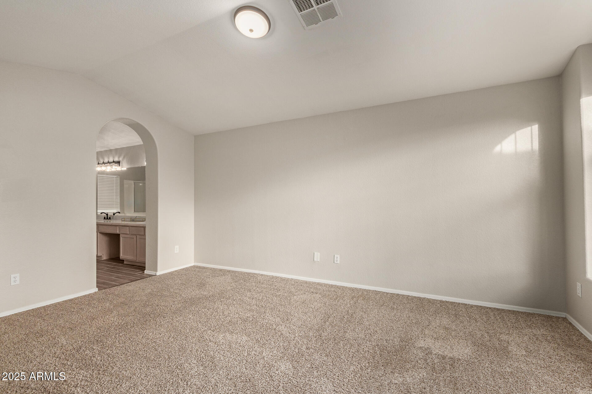 4522 East Rowel Road Phoenix, AZ 85050 - Photo 25 of 49 a view of empty room with a fireplace and wooden floor