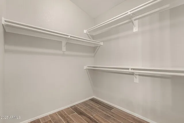 a view of an empty walk in closet