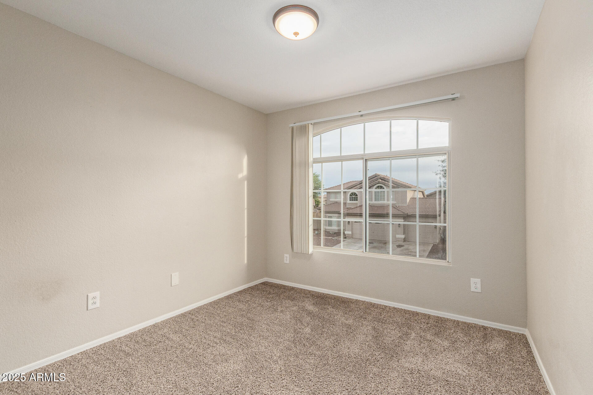 4522 East Rowel Road Phoenix, AZ 85050 - Photo 34 of 49 an empty room with a window